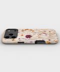 Pressed Wildflower Meadow MagSafe iPhone Tough Case low angle lifestyle product view