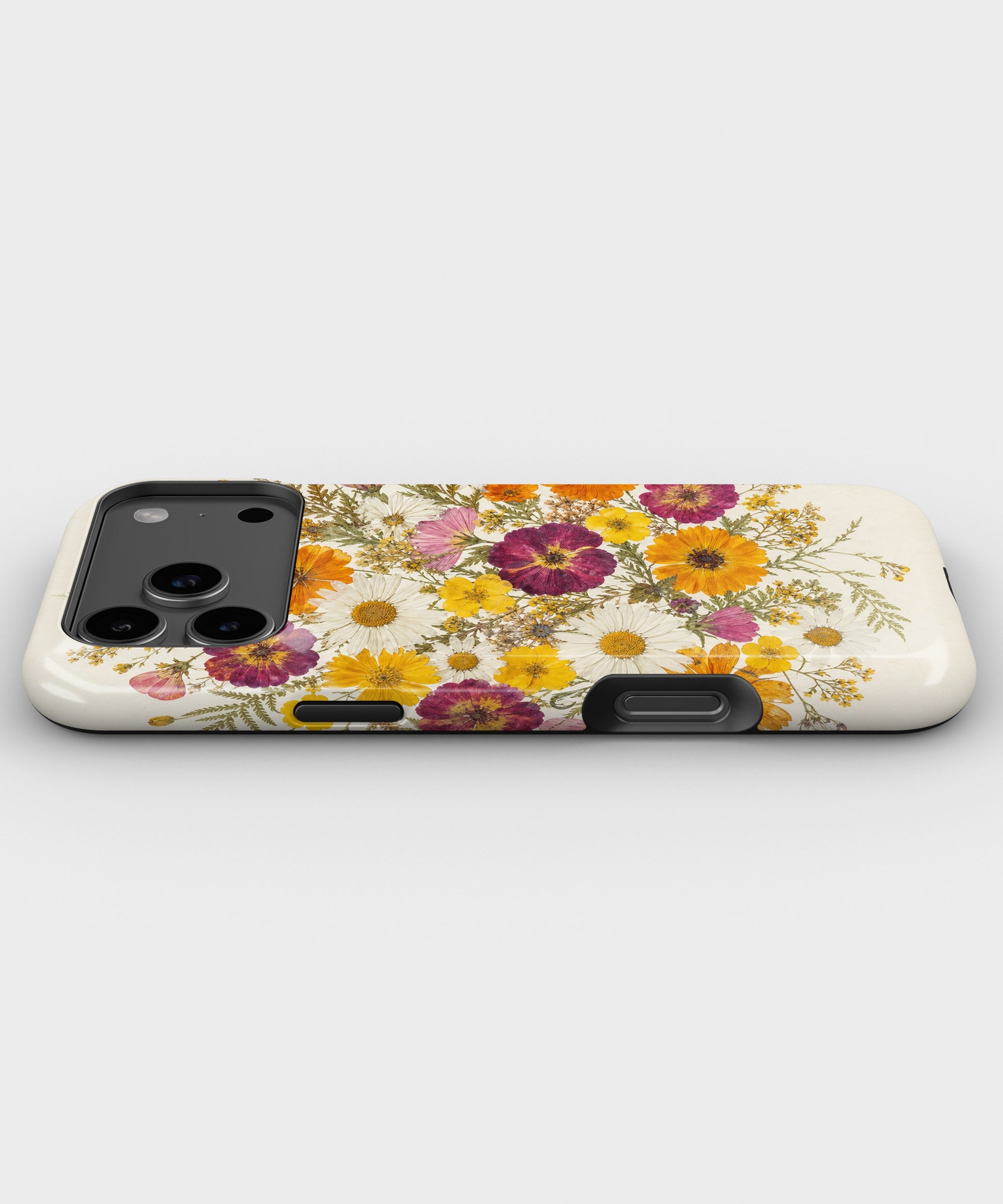 Pressed Daisy Wildflower Bouquet dual-layer iPhone case with raised camera and edge protection
